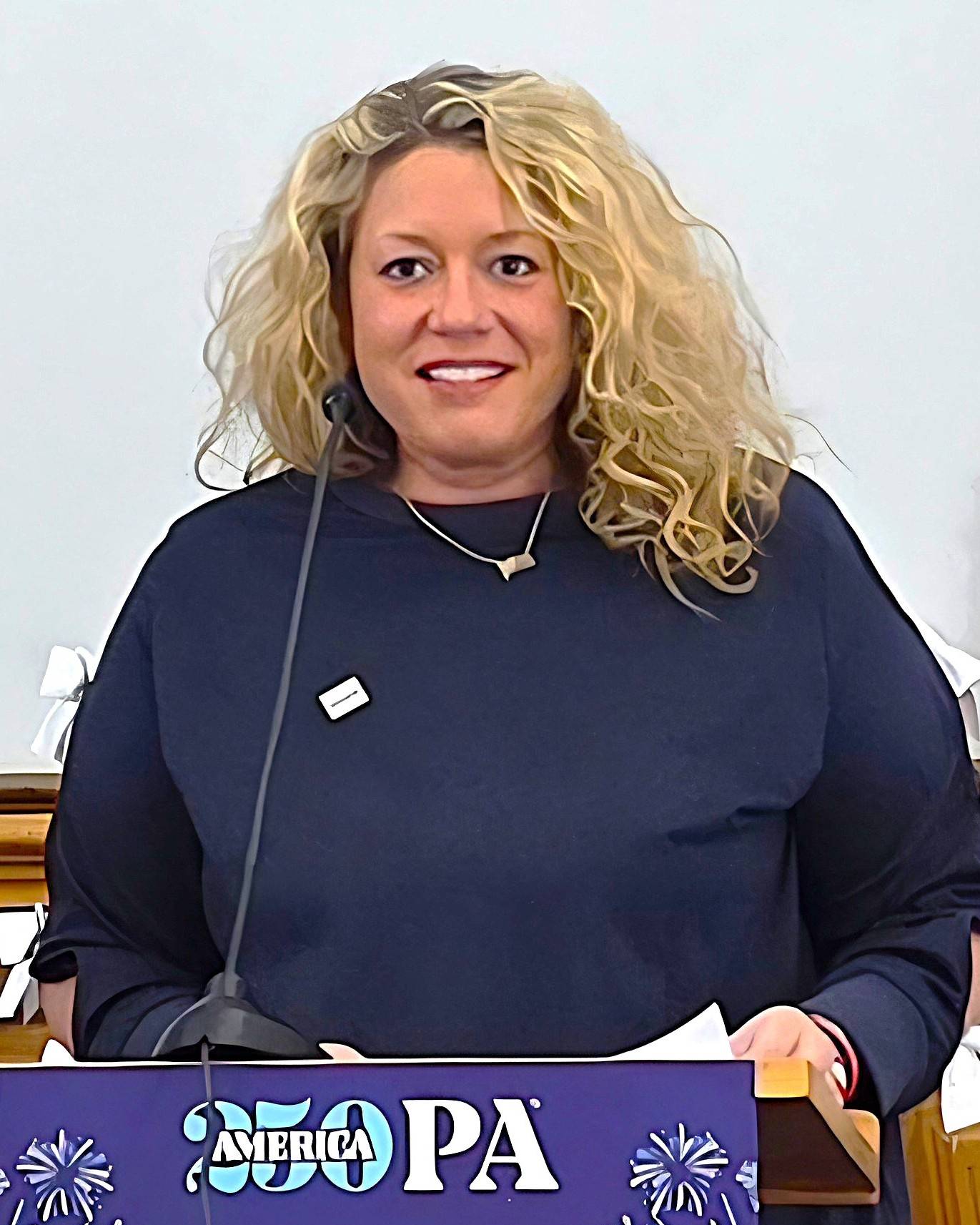 Woman speaking at America250 event